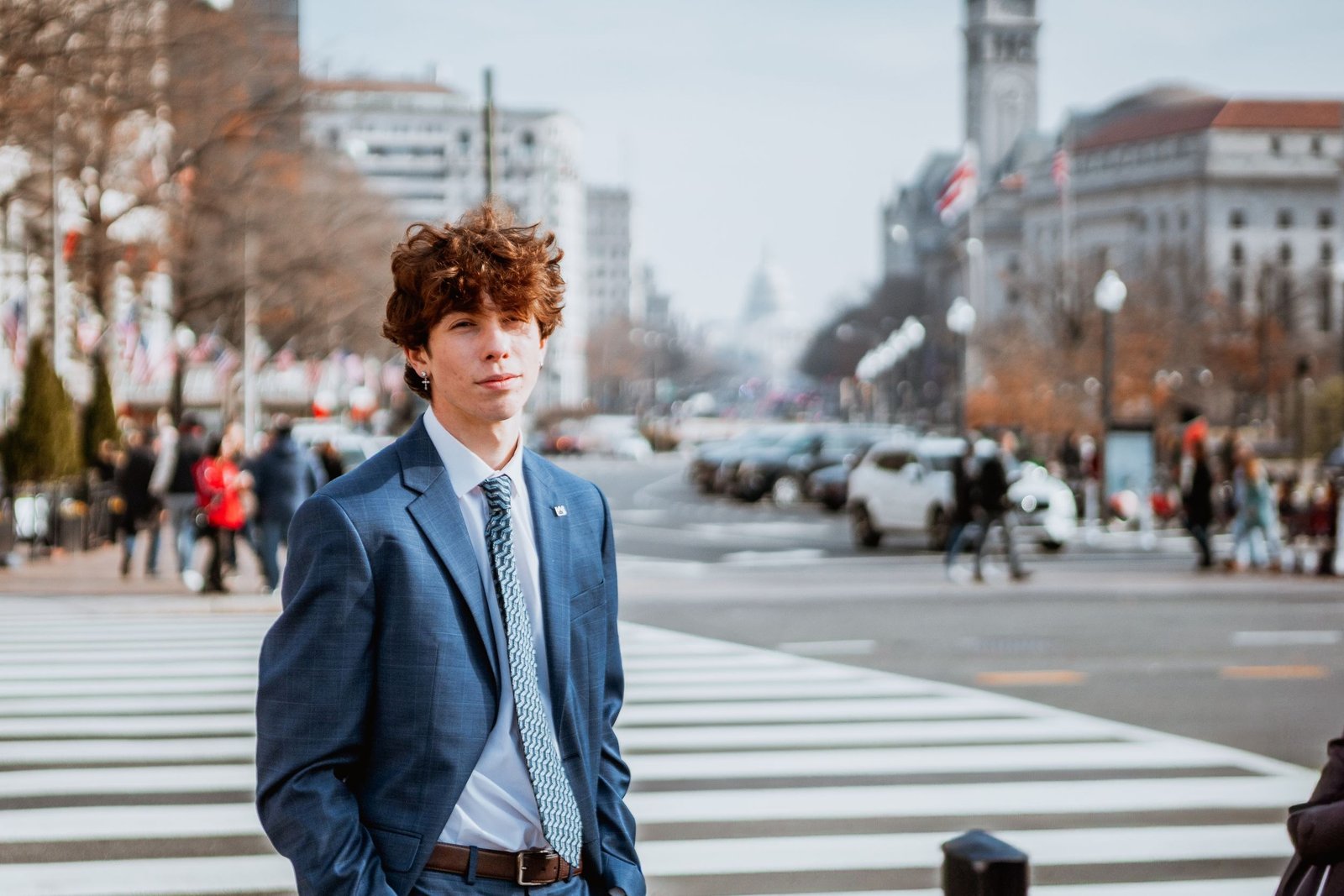 Gabe Key in a blue suit on a city street.