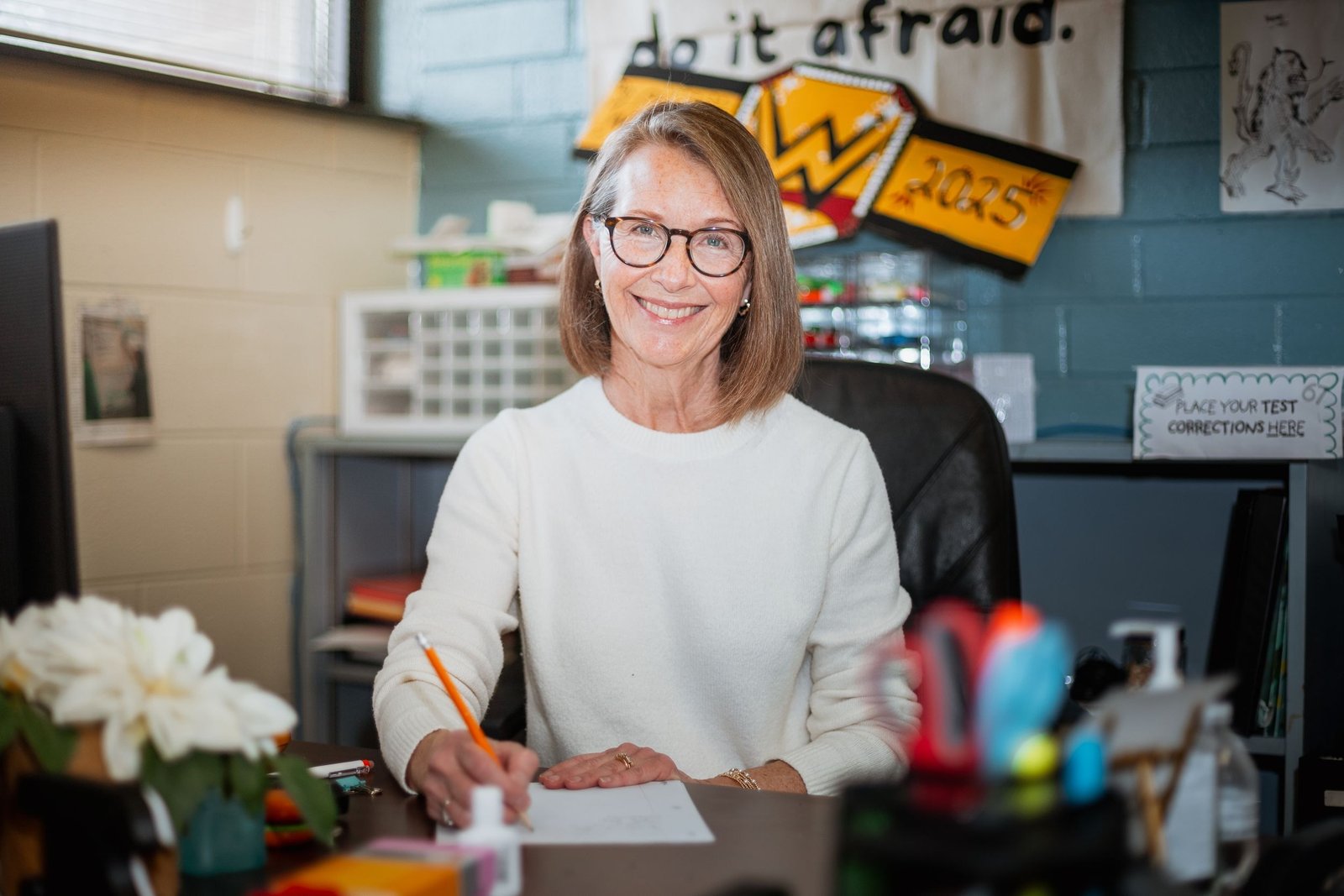 Business portrait of a woman at her desk.